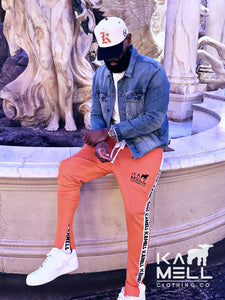 KAMELL ORANGE TRACK PANTS