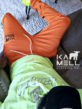 KAMELL ORANGE TRACK PANTS